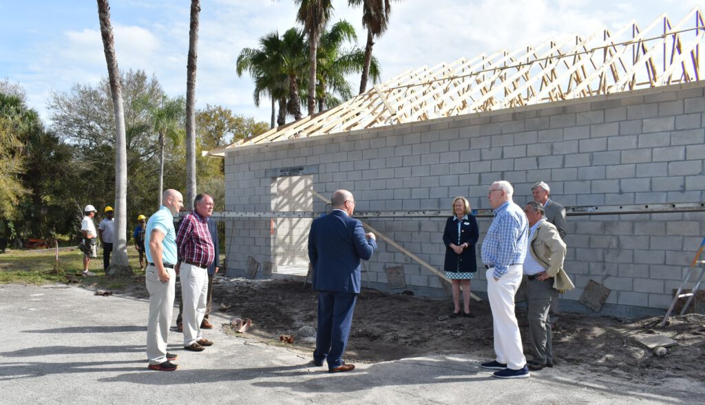 IRCF President and CEO Jeff Pickering talks to Camp Haven Staff and Board Members, along with IRCF Board Member.