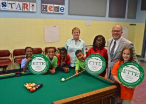 Boys & Girls Club of IRC Executive Director Elizabeth Thomason, Indian River Community Foundation Executive Director Jeff Pickering, and children of the Boys & Girls Club of IRC